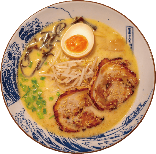 Ramen Ippin signature tonkotsu ramen — golden bone broth, chashu pork, bean sprouts and black fungus in a Hokusai wave bowl